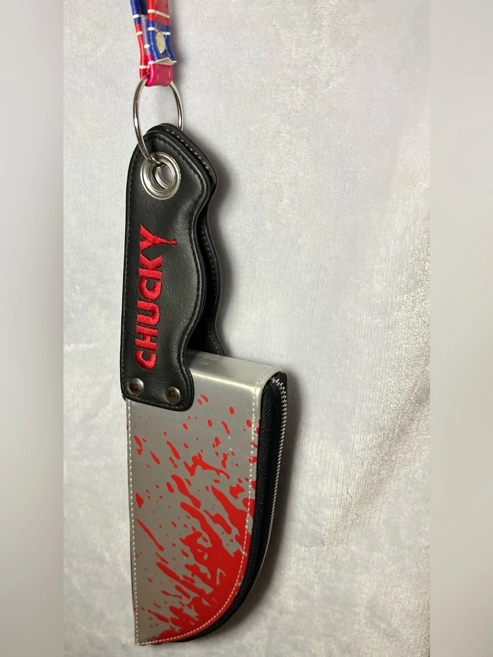Spencer's Silver & Red Chucky Phone Case Pouch with Keyring Strap